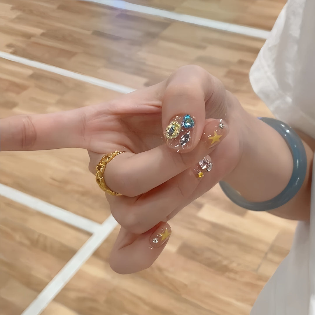 Glittering nail tips with elegant jewelry accents Stornfield