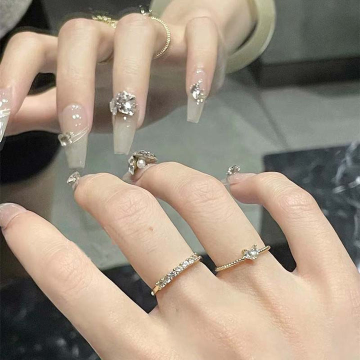 Art nail set with filigree decorations and glamorous accents Stornfield