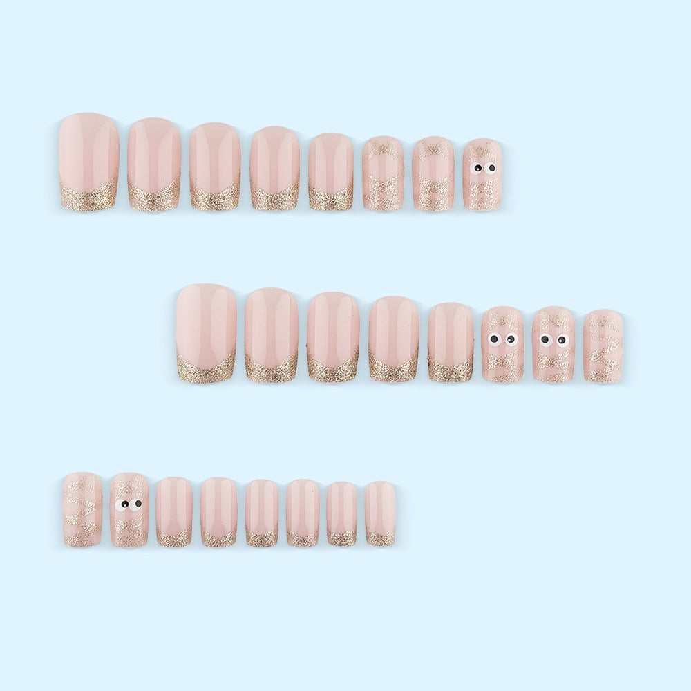 Artificials nails with playful eye design and glitter tips Stornfield