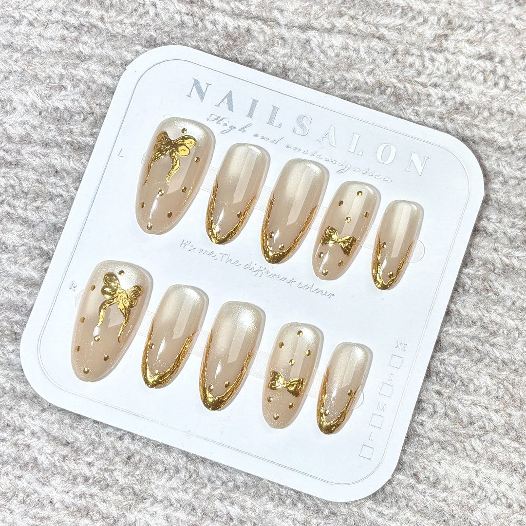 Elegant Press-On Nail Set with Gold Bow Accents