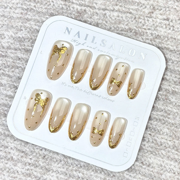 Elegant Press-On Nail Set with Gold Bow Accents