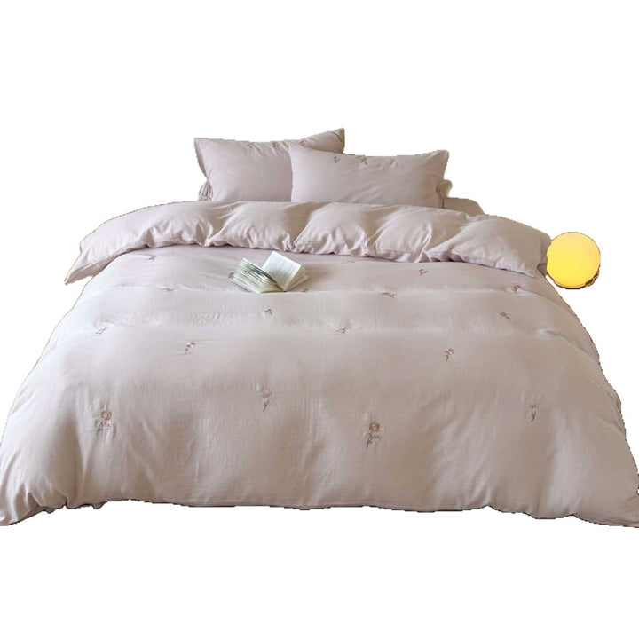 Breathable cotton bedding set with delicate flower embroidery and tie ribbon pillow