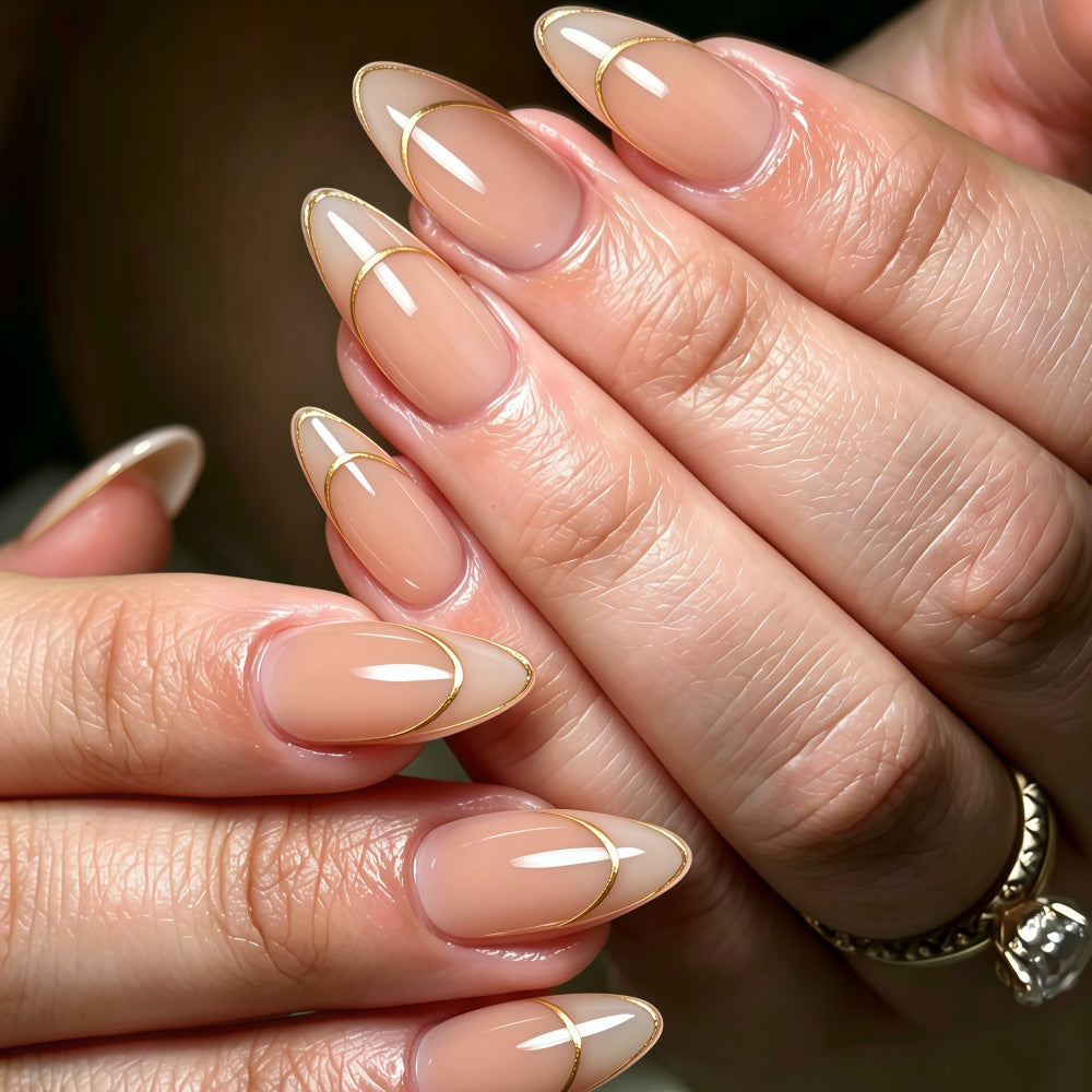 Artificial nails with elegant gold lines Stornfield