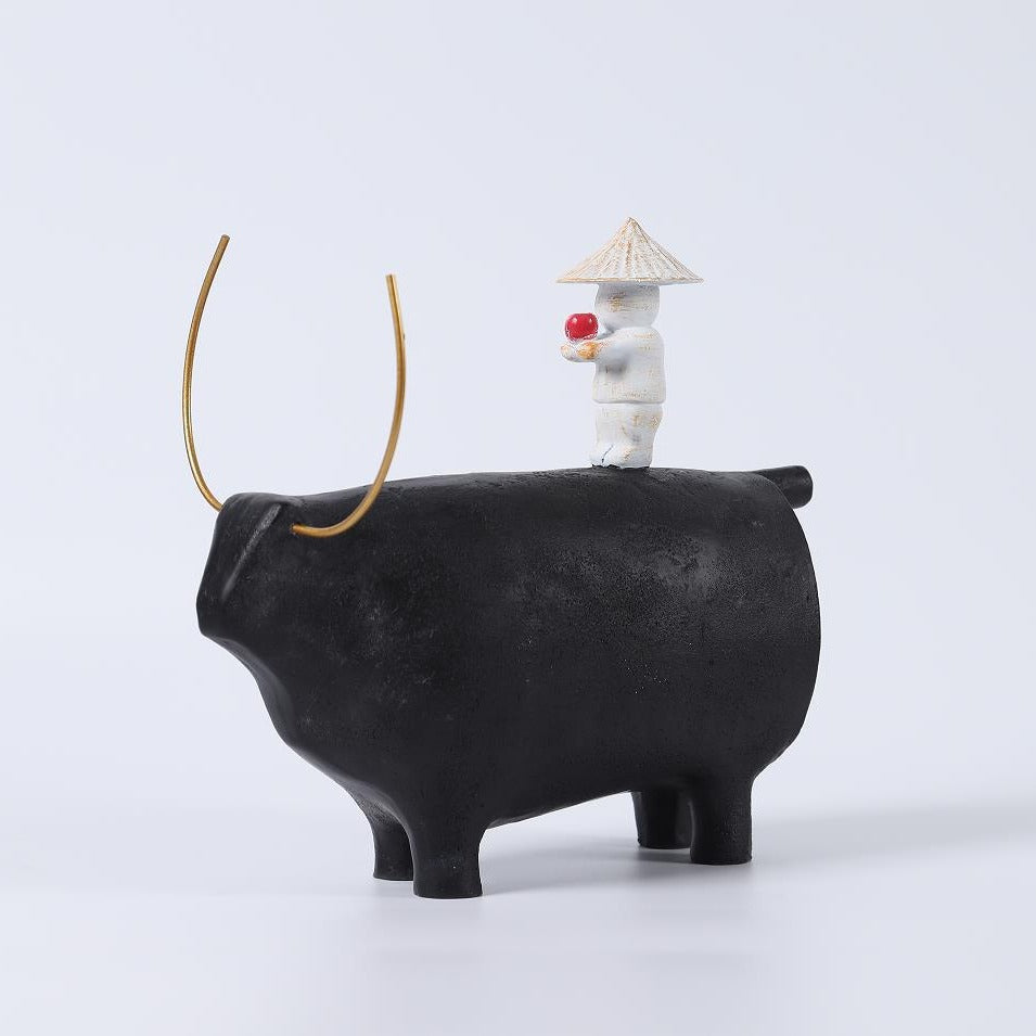 Decorative Angel Figurine on Black Bull Sculpture