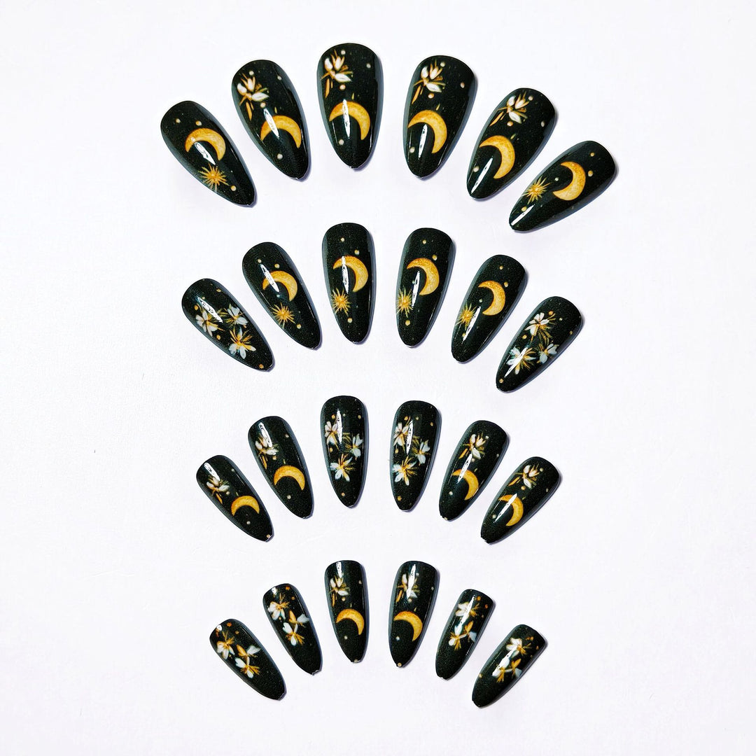 Glamorous artificial nails with moon and flower motifs Stornfield