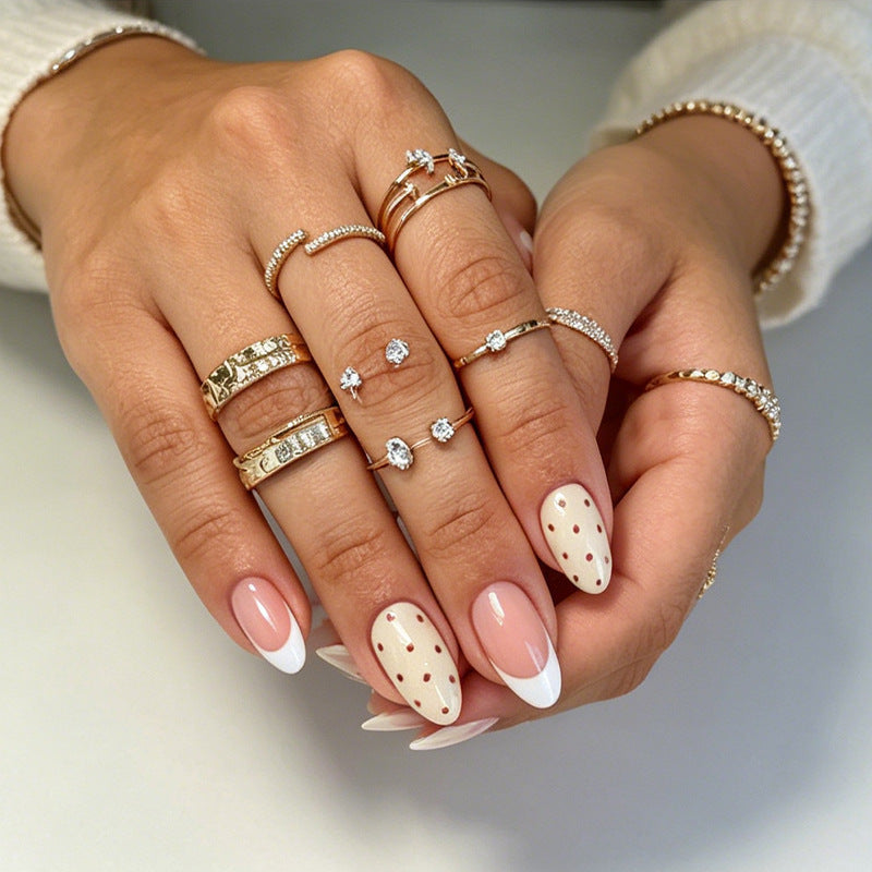 Artificial nails with elegant dots and glamorous accents Stornfield