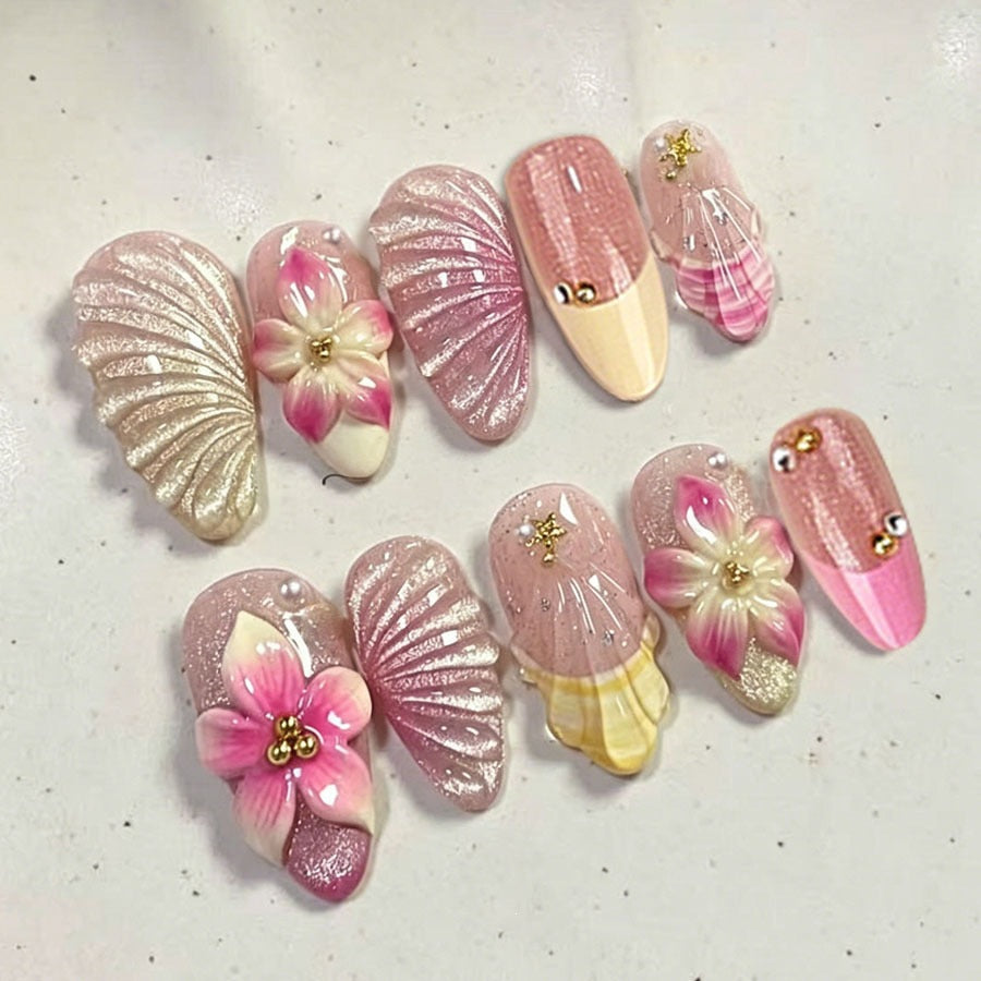 Artificial nail set with elaborate flower and shell patterns Stornfield