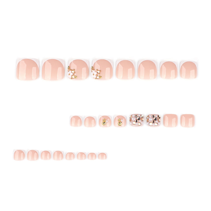 Glamorous toenail art with luxurious rhinestone and floral designs Stornfield