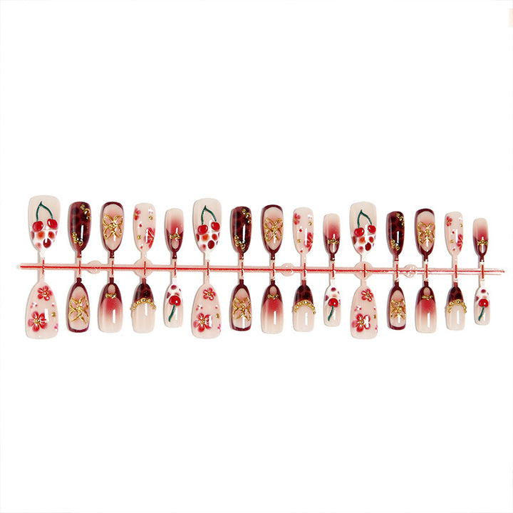 Artificial nail set with elegant floral designs and glitter effect Stornfield