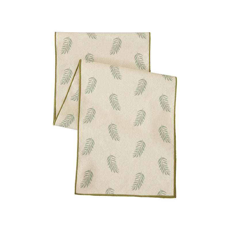 Woven table runner and placemat set made of cotton-linen with botanical scrolling pattern