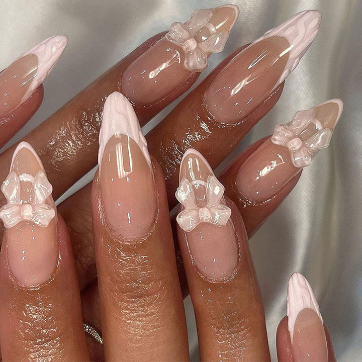 Artistic Nail Extensions with Transparent Bow Accents Stornfield
