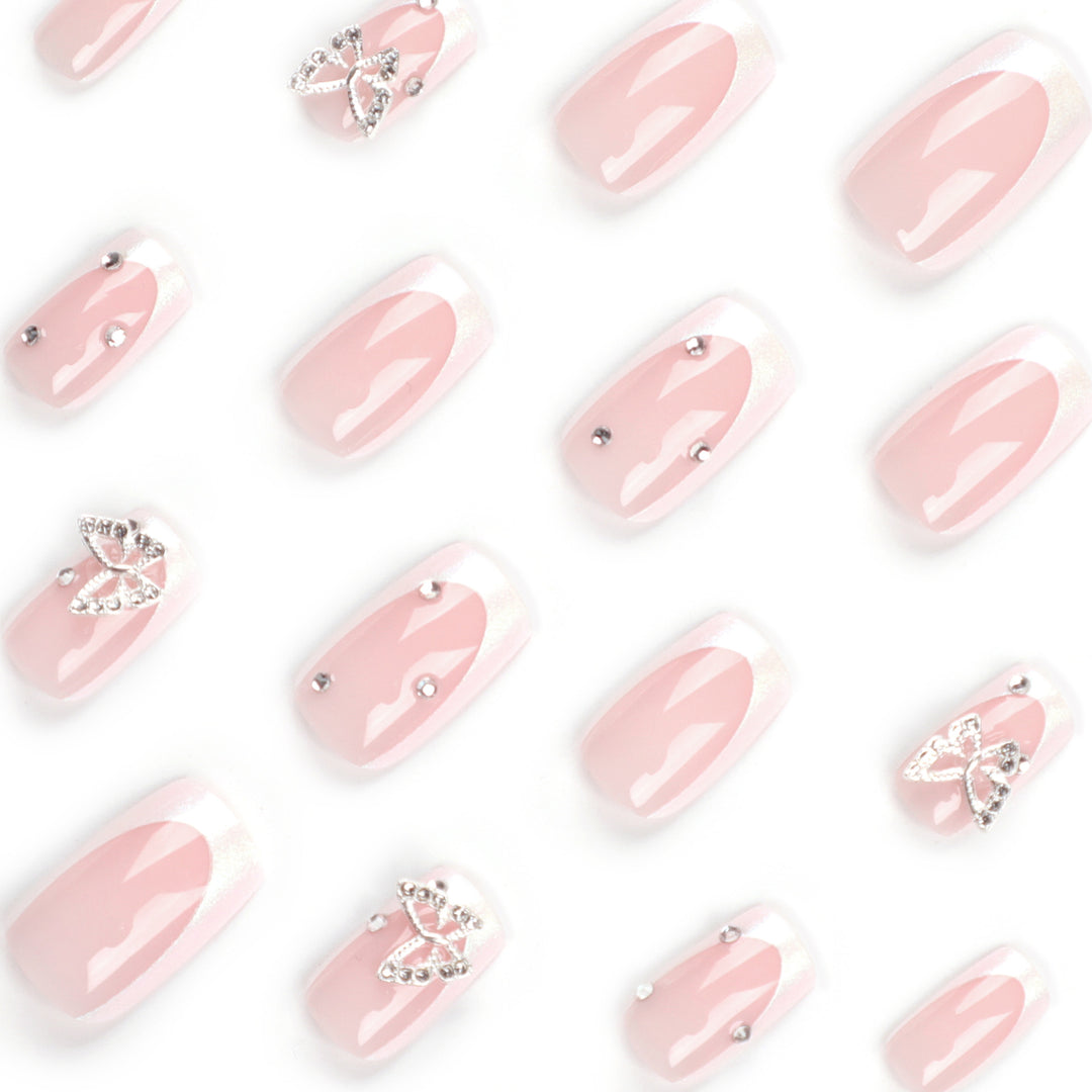 Elegant Nail Art with Glitter and Floral Accents Stornfield