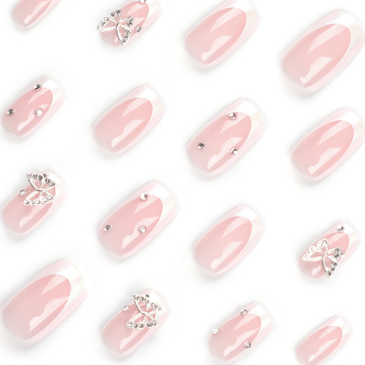 Elegant Nail Art with Glitter and Floral Accents Stornfield