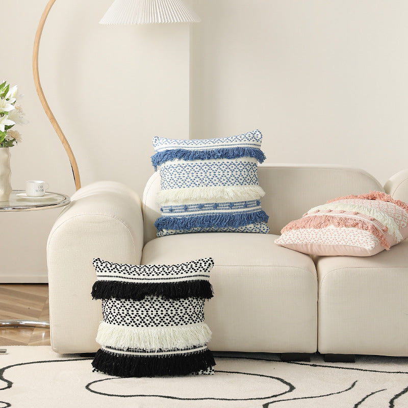 Textured Boho decorative pillow with fringes, tassels, and woven dot pattern