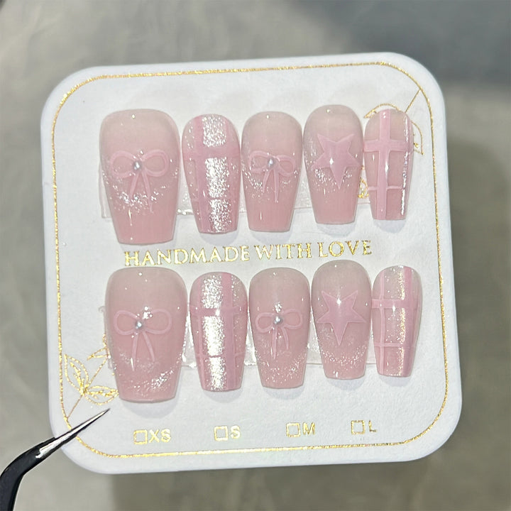 Artistic acrylic nails with elegant bow and star designs Stornfield