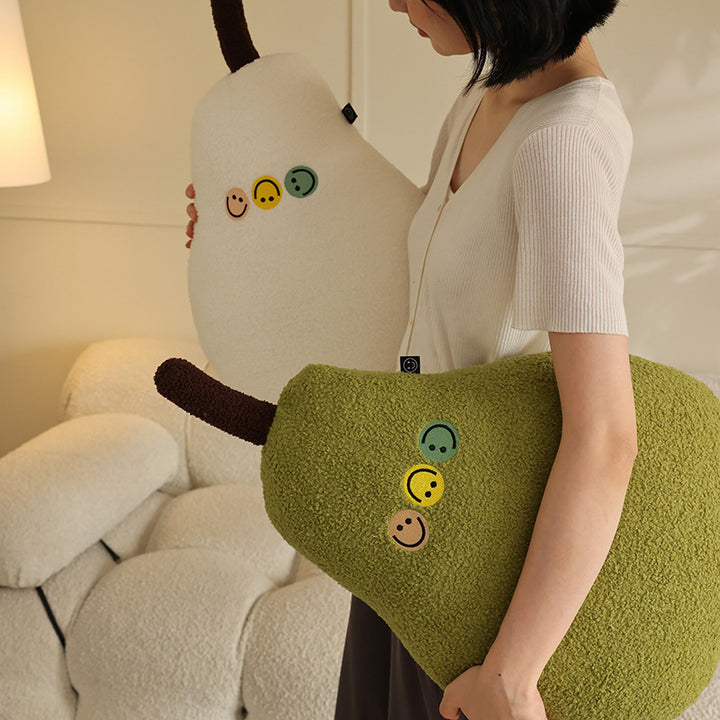 Pillow in pear shape made of teddy fleece with applied smileys