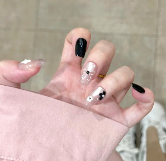Artistic Press-On Nail Design with Decorative Silver Accents Stornfield