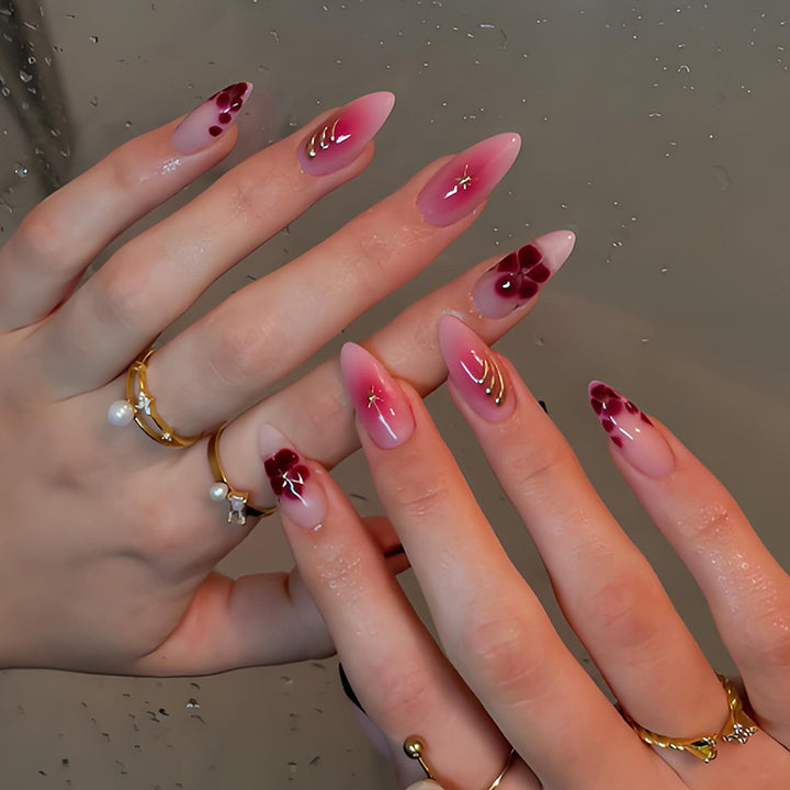 Artificial nails with elegant flower and glitter patterns Stornfield