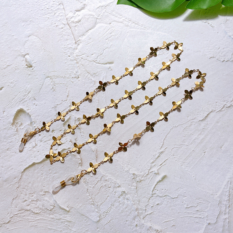 Fashionable glasses holder chain with filigree flower pendants Stornfield