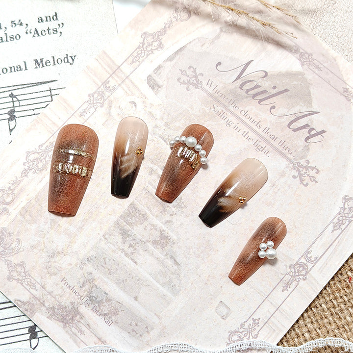 Artificial nails with elegant pearl and gold accents Stornfield