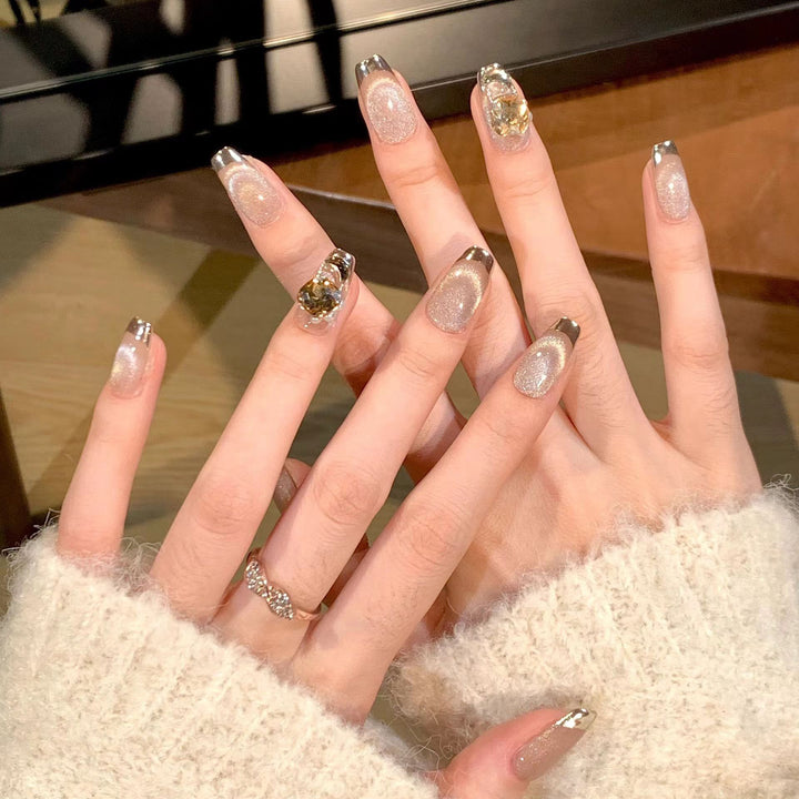 Artificial nail set with glamorous gold and glitter accents Stornfield