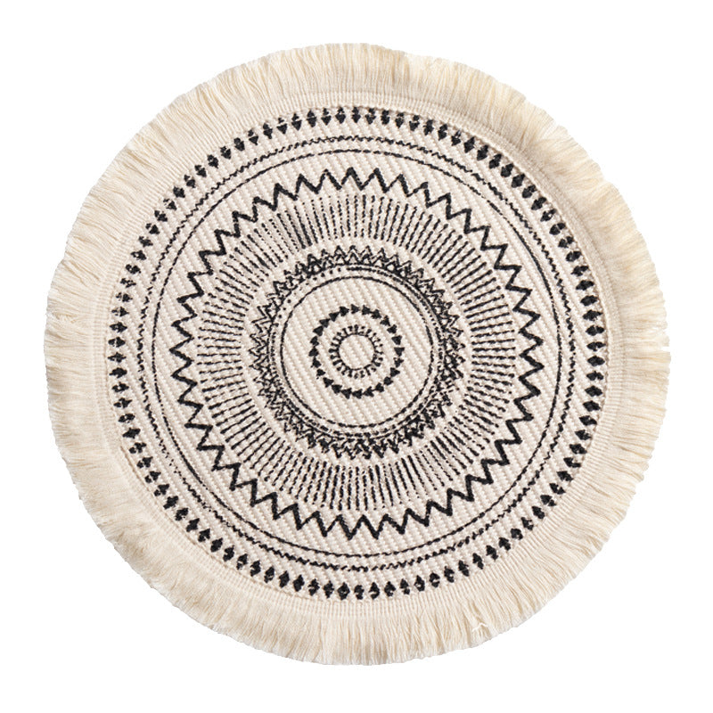 Round woven Boho rug mat with decorative fringes Stornfield