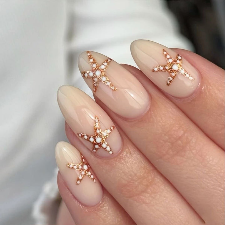 Glamorous stiletto nails with elegant star design Stornfield