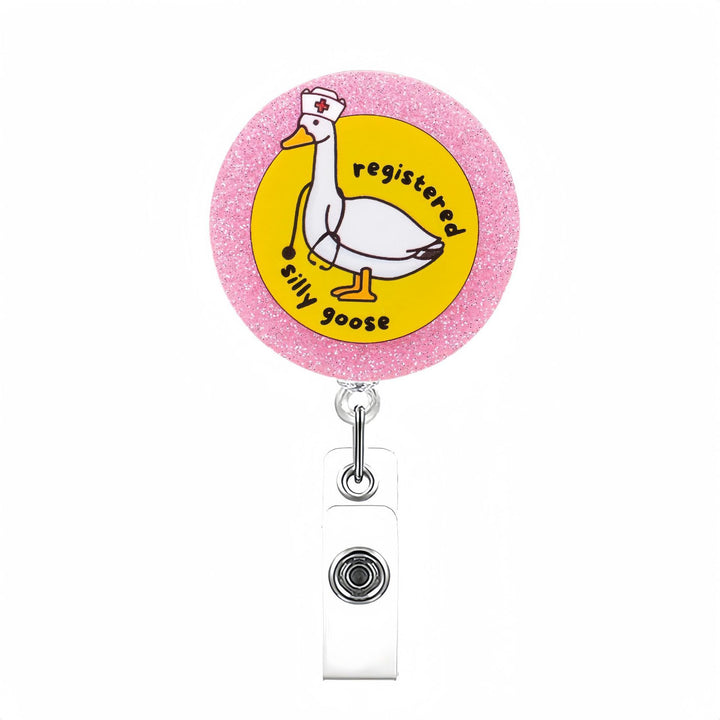 Expandable badge holder with anatomical heart pendant