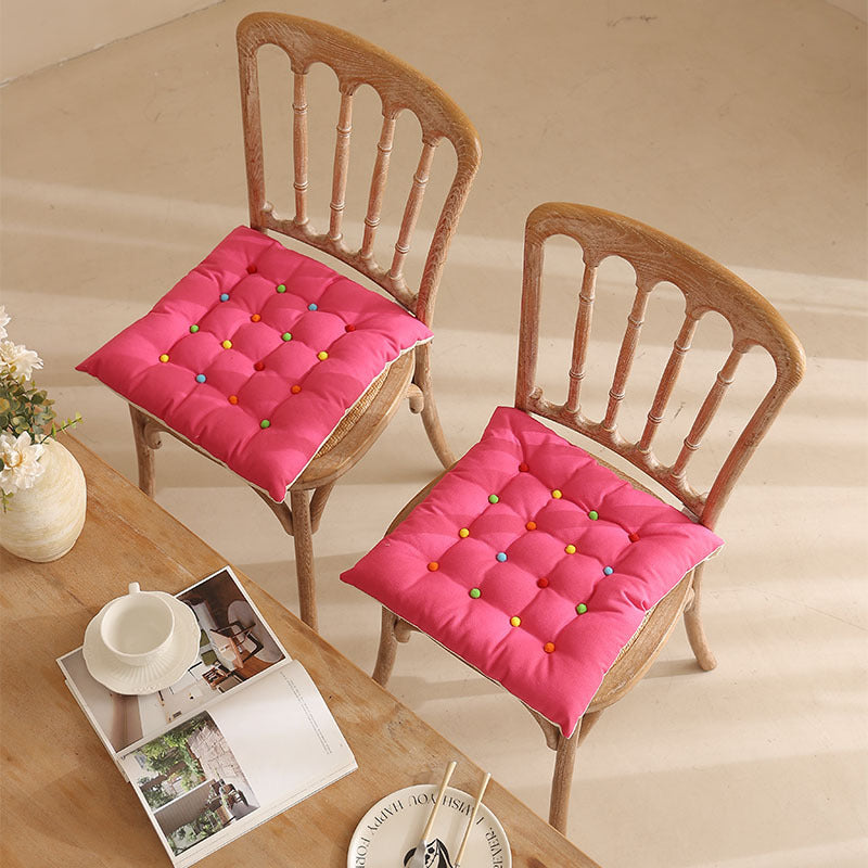 Padded quilted seat cushion with colorful button applications and non-slip underside Stornfield