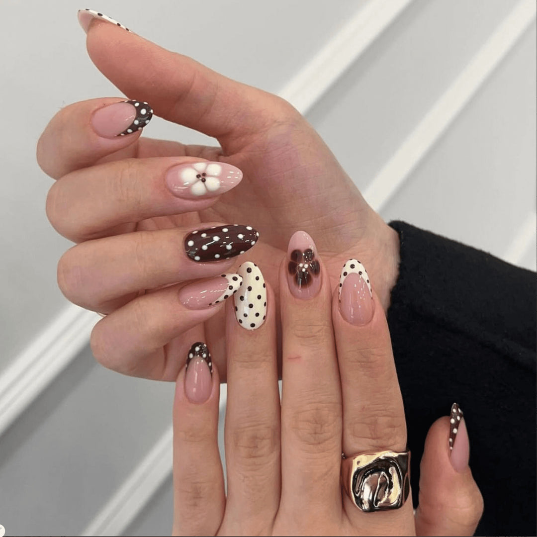 Artful nail art with floral design and various patterns Stornfield