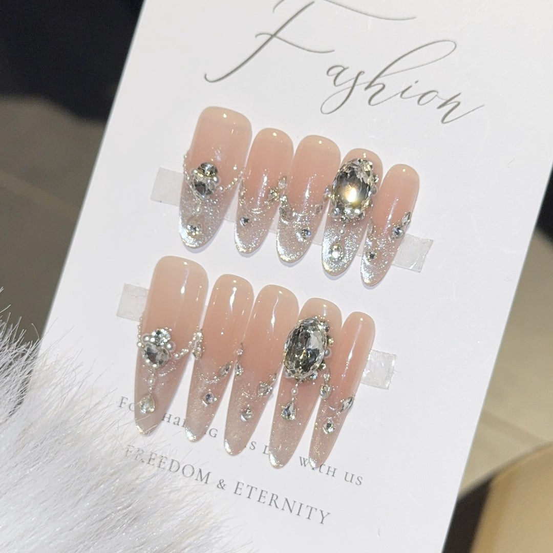Glamorous artificial nail tips with rhinestone accents Stornfield