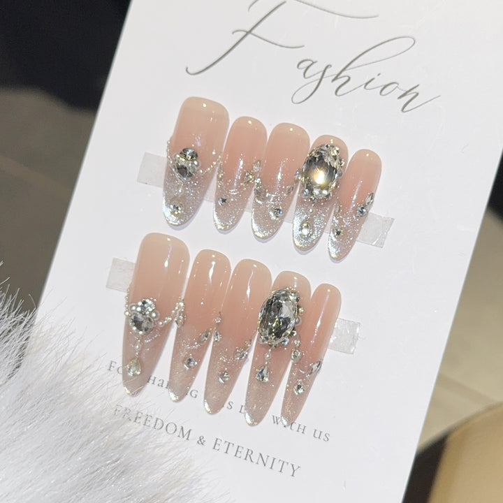 Glamorous artificial nail tips with rhinestone accents Stornfield