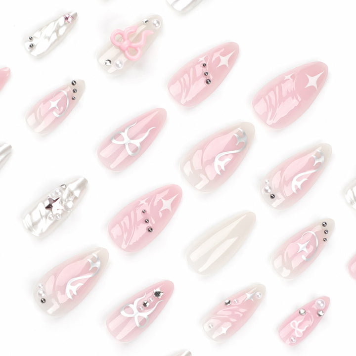 Artful stiletto nails in an elegant design with creative embellishments Stornfield