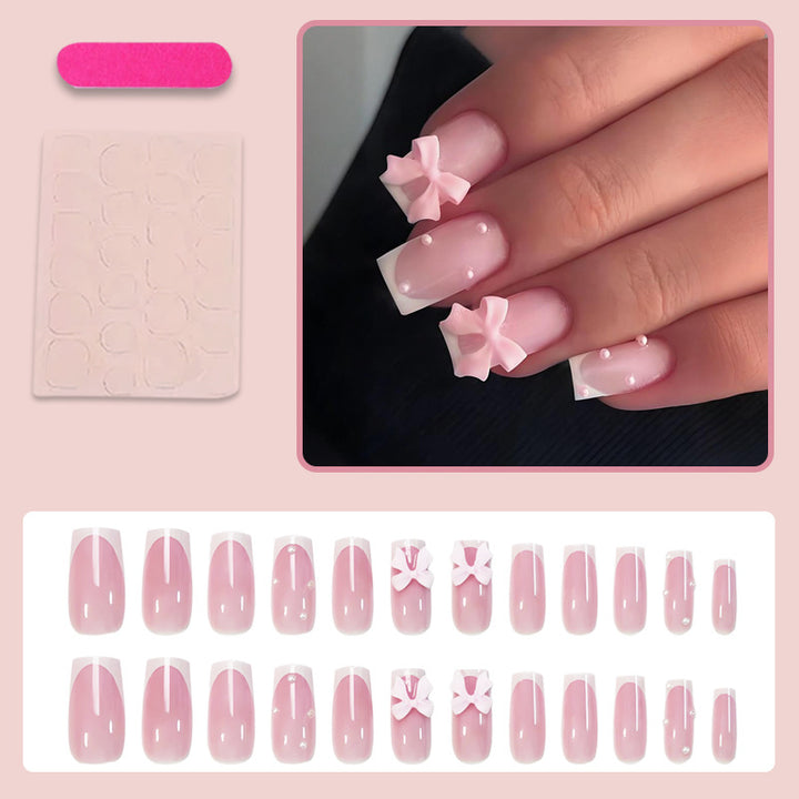 Glamorous artificial nail set with elegant bows and glitter accents Stornfield