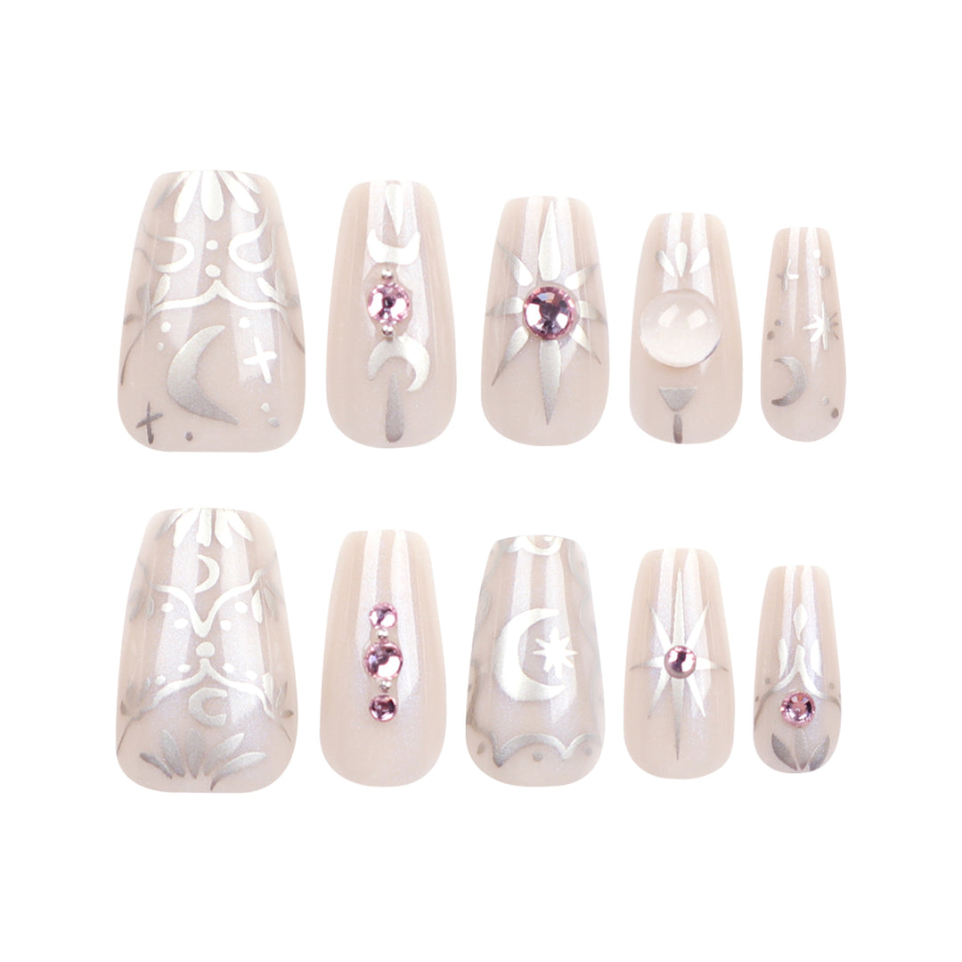 Artificial nail art with elegant rhinestone and glitter effects Stornfield