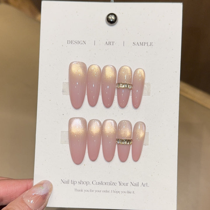 Glamorous artificial nails with elegant glitter and rhinestone application Stornfield