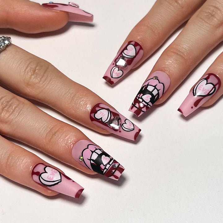 Artful stiletto nails with hearts and glitter accents Stornfield