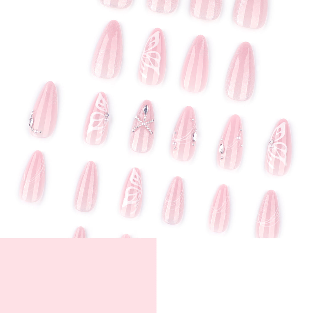 Artful nail extensions with delicate flower and glitter accents Stornfield