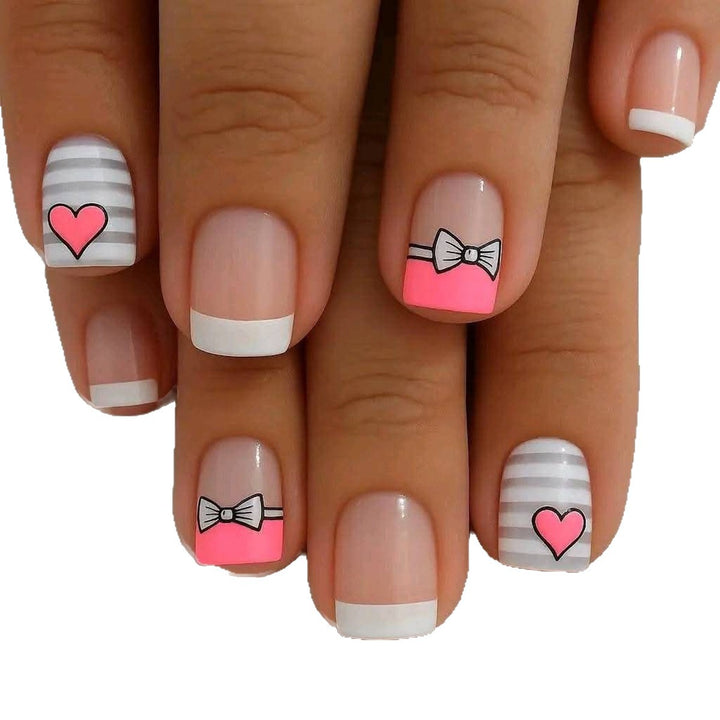 Artificial nails with playful heart and bow pattern Stornfield