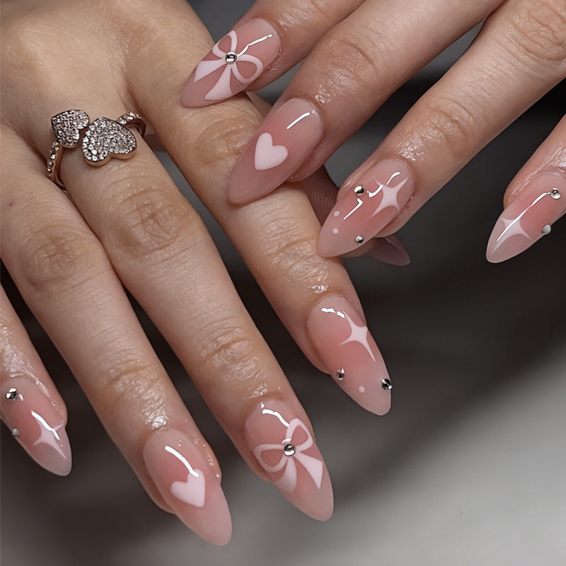 Artificial nail set with romantic heart and bow motifs Stornfield