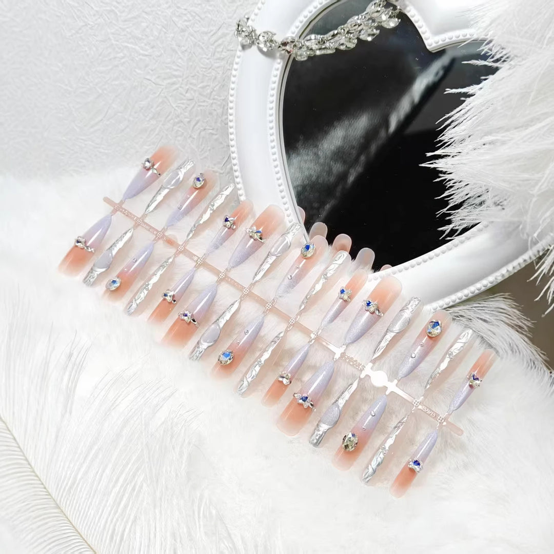 Artificial nails with elegant glitter design and fine 3D decorations Stornfield
