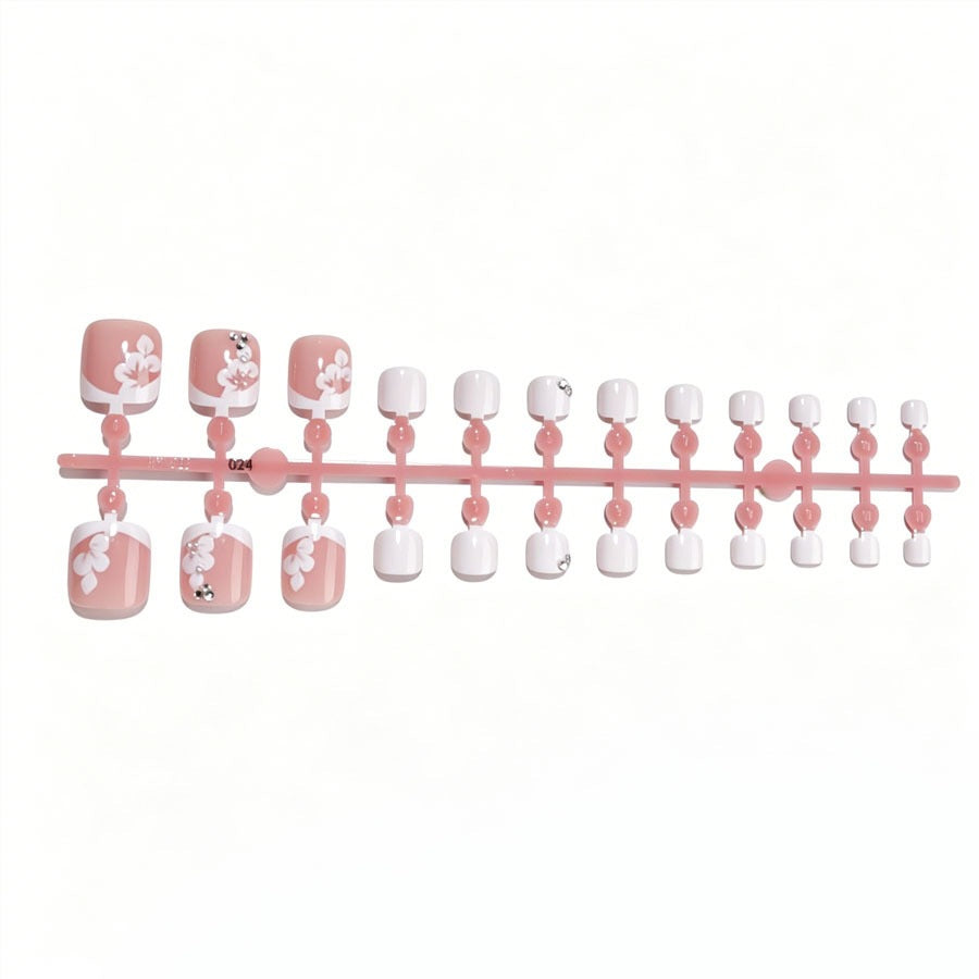 Nail art set with elegant flower design and glitter accents Stornfield