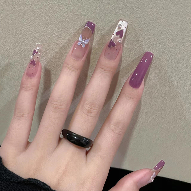 Artistic Press-On Nail Design with Butterfly Accents Stornfield
