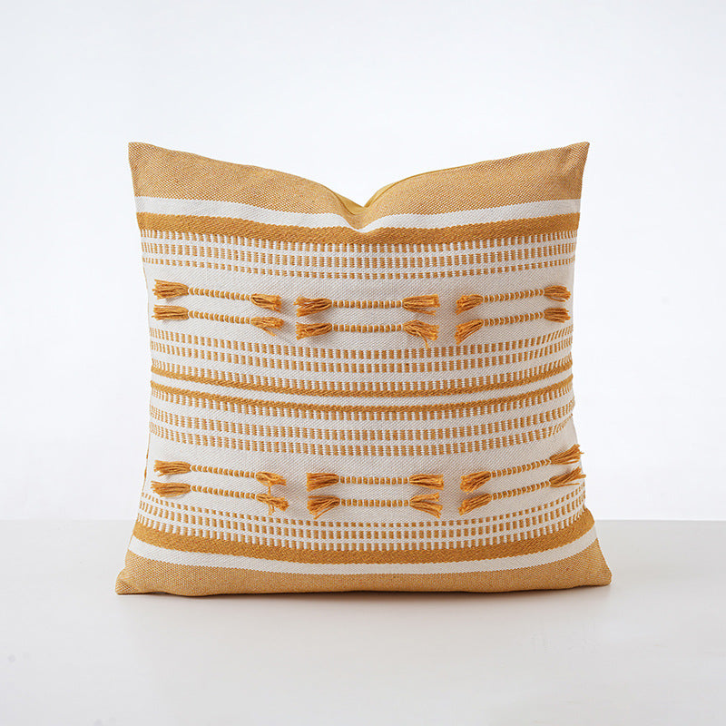Structured square decorative pillow with crocheted trim and striped knit texture
