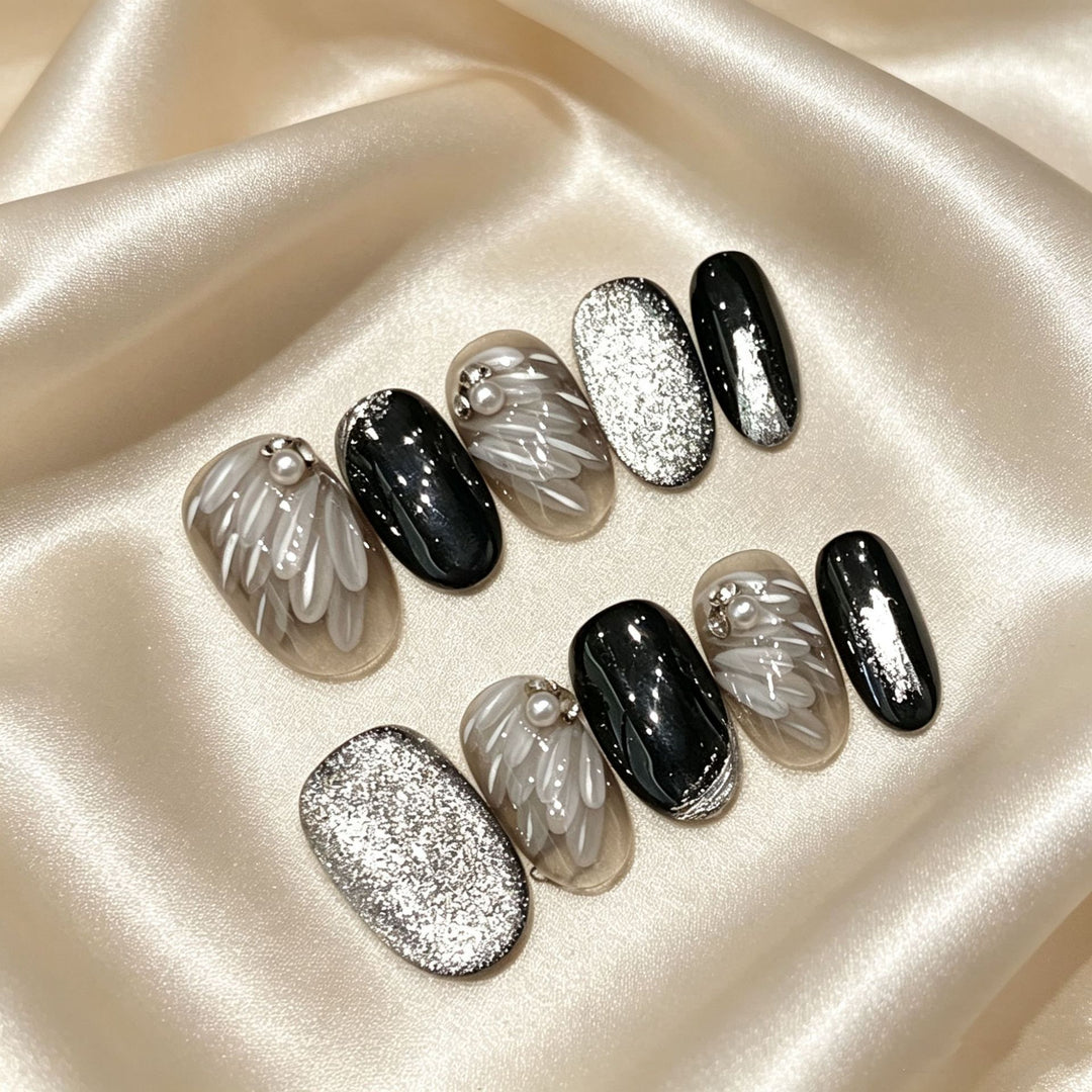 Artistic Press-On Nail Set with Elegant Silver and Black Designs