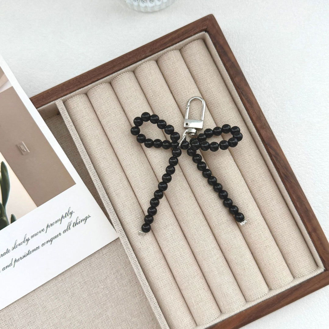 Elegant Pearl Bow Keychain Stornfield