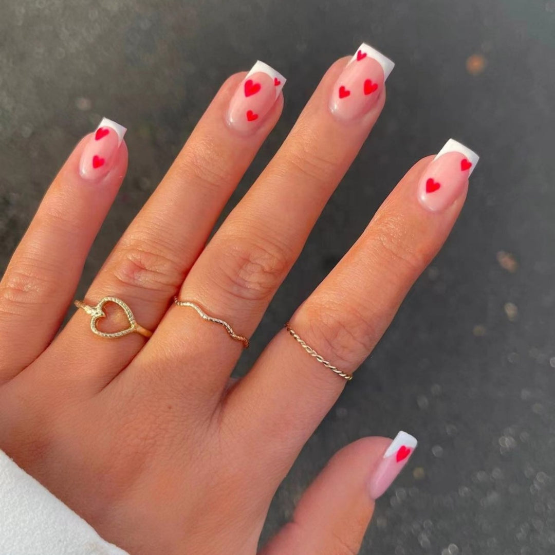 Heart-Embellished French Tip Nail Art Stornfield