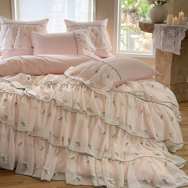 Vintage-inspired ruffle bed set with fine floral embroidery and ruched coverlet