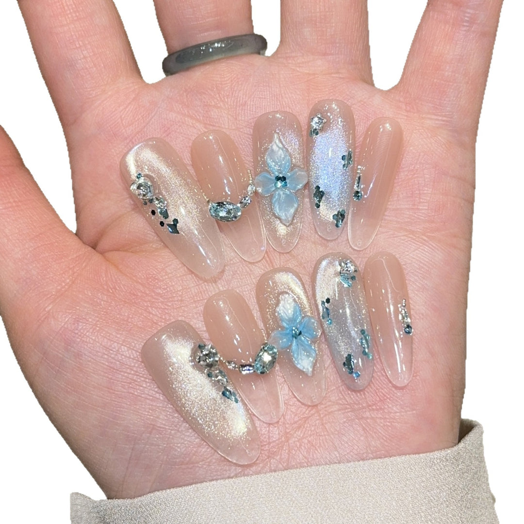 Artificial nails with unique floral design and glitter accents Stornfield