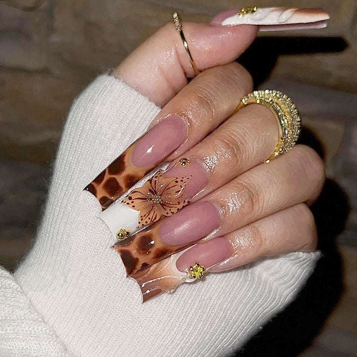 Creative nail art set with floral accents and ombre effect Stornfield